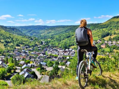 active woman biking countryside- Aveyron in France